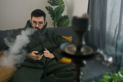 Portrait of young man working at home