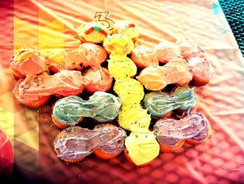 High angle view of multi colored candies on table