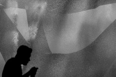 Shadow of people on wall