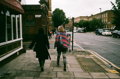Woman standing on city street