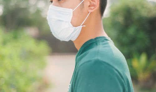 Midsection of woman standing outdoors