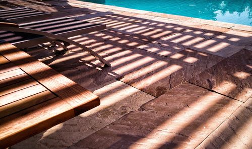 High angle view of swimming pool by sea on sunny day