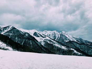 Scenic view of snowcapped mountains against sky