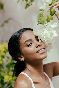 Portrait of woman with flowers