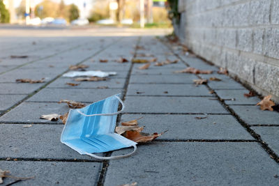 Close-up of mouth nose protection on sidewalk in city