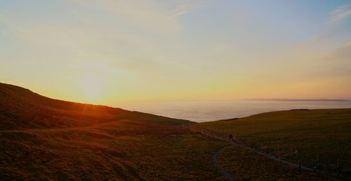 Scenic view of landscape against sky during sunset