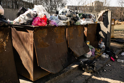 Dumpsters being full with garbage. garbage cans with garbage