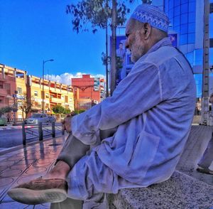 Side view of man in city