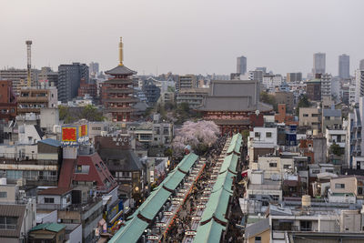 High angle view of buildings in city against sky