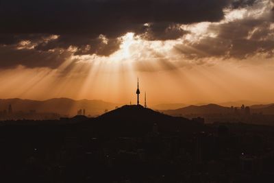 Scenic view of silhouette mountains against sky during sunset