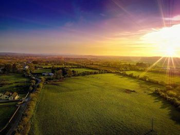 Aerial view of landscape against sky during sunset