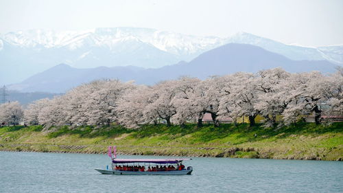 Scenic view of lake and mountains against sky