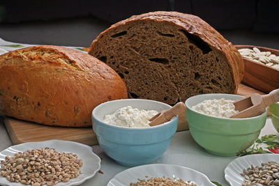 Bread with flour and wheat on kitchen table