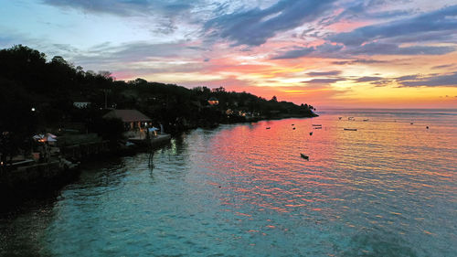 Scenic view of sea against orange sky