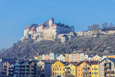 Low angle view of buildings against blue sky