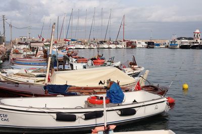 Boats moored at harbor