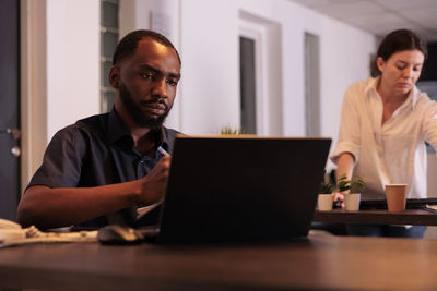 Man using laptop at office