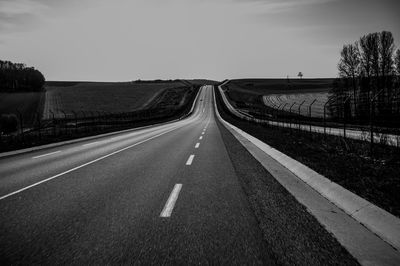 Empty road along landscape