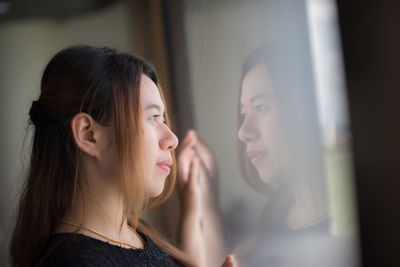 Portrait of young woman looking at camera