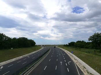 Highway by road against sky