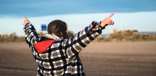 Man with raised arms