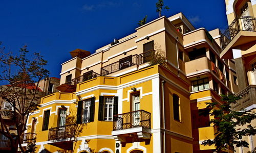 Low angle view of building against blue sky