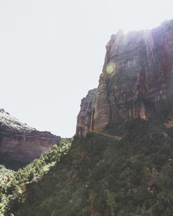 Low angle view of rock formations against sky