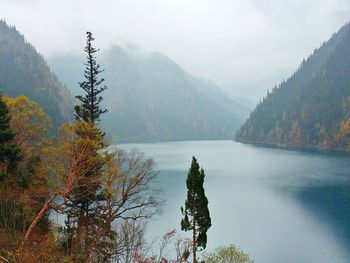 Scenic view of lake with mountains in background