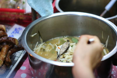 Close-up of person preparing food in kitchen