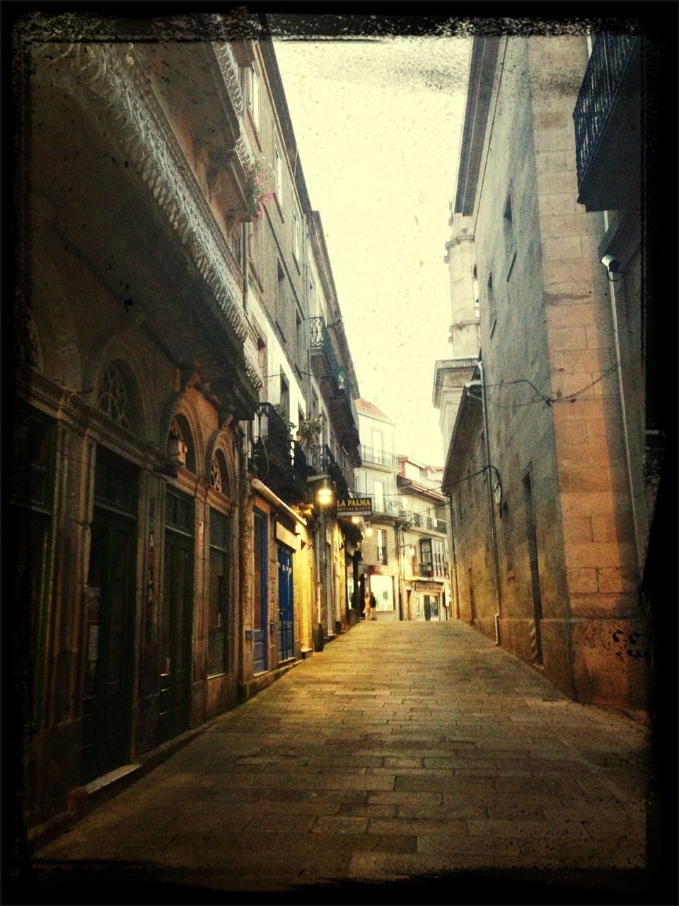 architecture, building exterior, built structure, the way forward, transfer print, diminishing perspective, street, city, auto post production filter, alley, building, residential building, narrow, vanishing point, residential structure, road, transportation, sky, residential district, city life