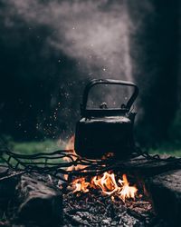 Tea kettle on bonfire in forest