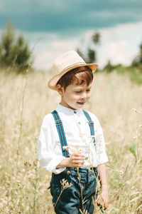 Man wearing hat standing on field