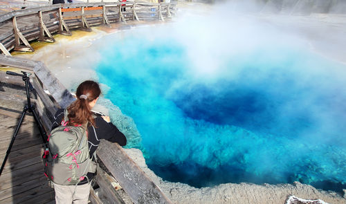 Full length of woman standing on water