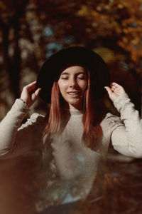 Portrait of young woman in hat