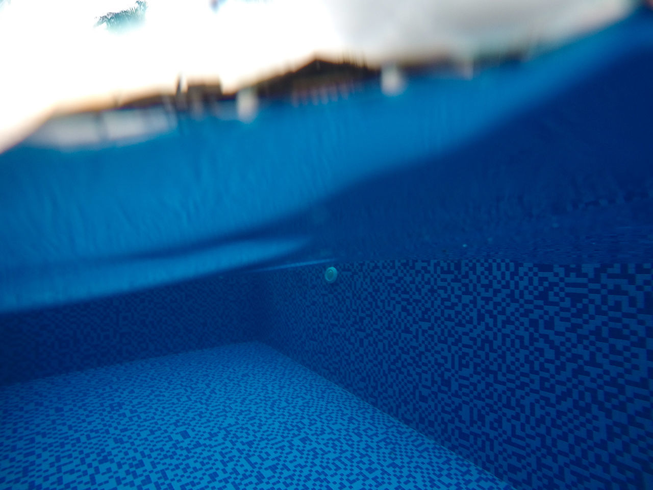 CLOSE-UP OF SWIMMING POOL WITH REFLECTION