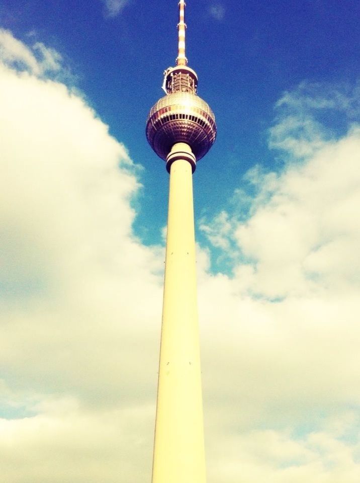 tower, communications tower, low angle view, tall - high, international landmark, sky, communication, architecture, famous place, travel destinations, tourism, television tower, built structure, capital cities, culture, cloud - sky, travel, fernsehturm, sphere, spire