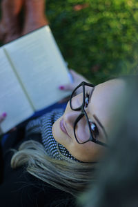 Portrait of smiling young woman with book