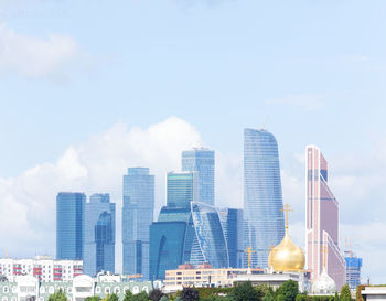 Modern buildings in city against sky