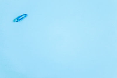 High angle view of blue sky over white background