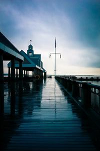 Pier over sea against sky