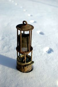 Close-up of snow on metal