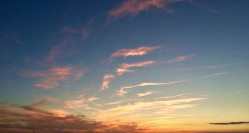 Low angle view of cloudy sky at sunset