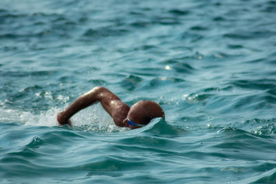 Man swimming in sea