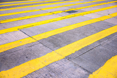 High angle view of yellow zebra crossing on road