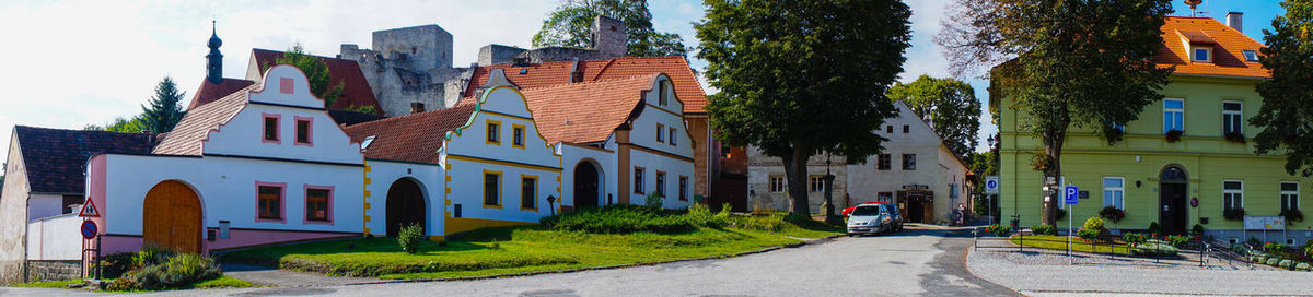 Houses in city against sky