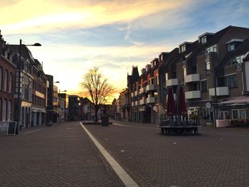 Buildings in city at sunset