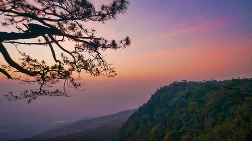 Scenic view of mountains against sky at sunset