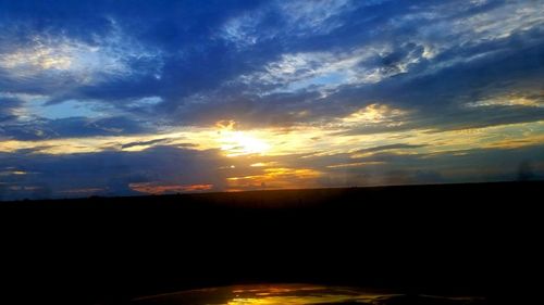 Scenic view of silhouette landscape against sky during sunset