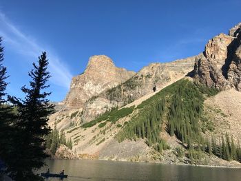 Scenic view of mountains against clear blue sky