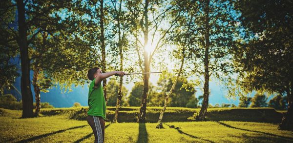 Side view of boy playing at park